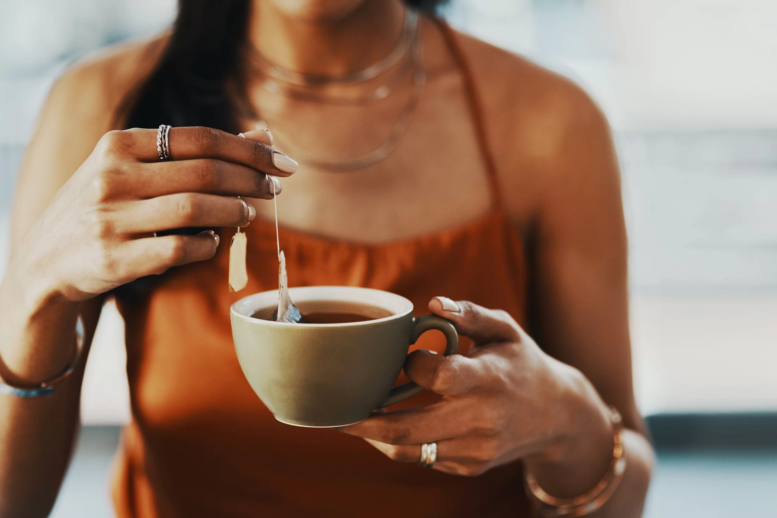 Photo of lady holding a mug of tea